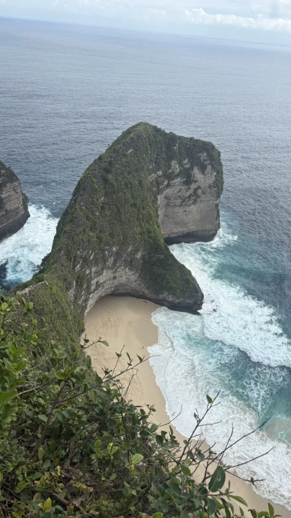 The famous T-Rex cliffside at Kelingking Beach on Nusa Penida, with the turquoise water below.