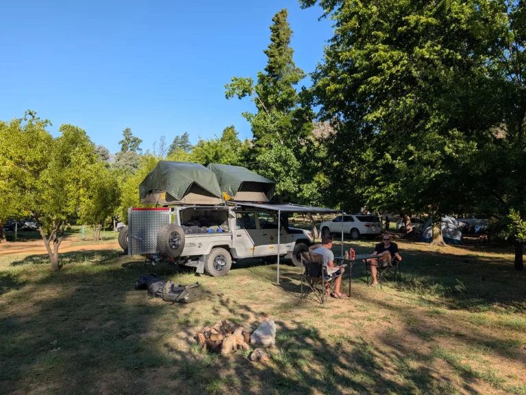 Landcruiser with rooftop tents parked in Beaverlac Camp (South Africa).