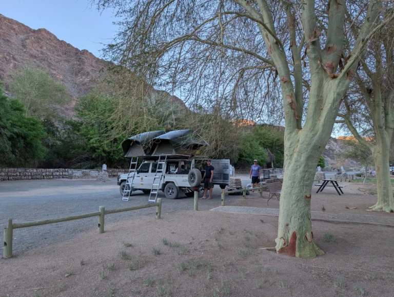 Toyota Landcruiser with two rooftop tents parked in Ai-Ais Campsite.