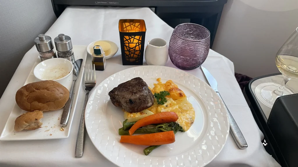In-flight dining: Filet mignon with mashed potatoes and vegetables served in Qatar Airways Business Class.